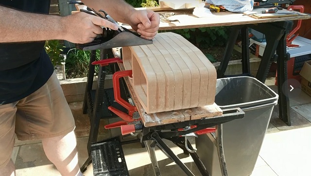 Planing and sanding the cabinet.